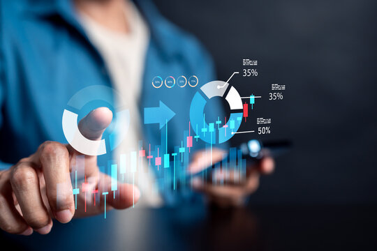 Portfolio rebalancing for risk reduction and profit concept. Person pointing at donut chart and candlestick graph.