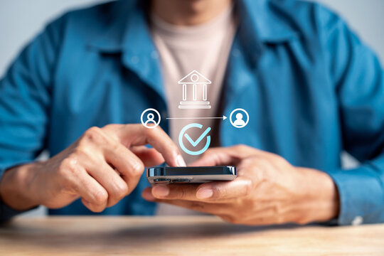 Secure financial transaction and mobile banking solution. Man using smartphone for safe money transfer and verified payment system.