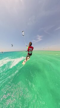 fast kitesurfer riding turquoise sea under clear sky controlling kite with confidence enjoying freedom adventure summer lifestyle travel extreme water sport energy happiness healthy living outdoors