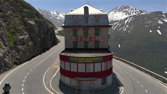 Hotel Belvedere on FurkaPass, Uri Canton, Switzerland. Abandoned hotel on the Furka mountain Pass at Sunny day, Aerial