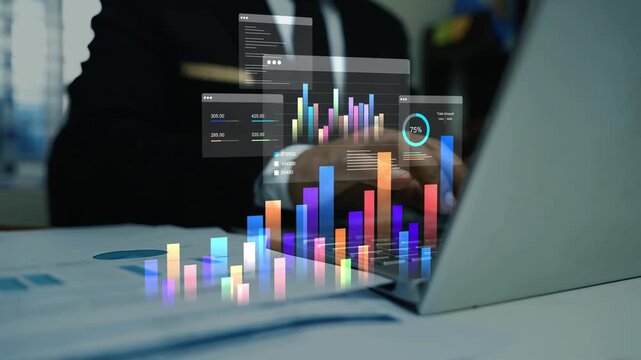 Business man working on laptop with holographic business data graph charts animation on screen, Digital business analytics dashboard hologram over laptop