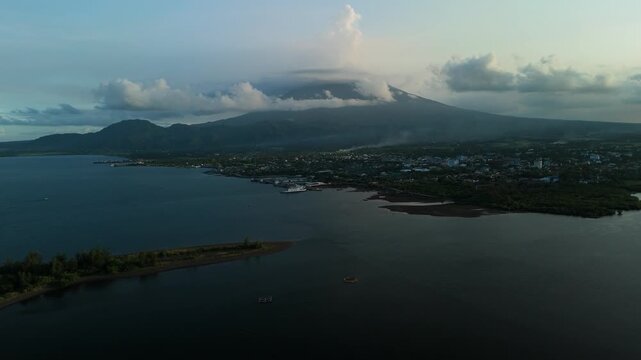 Tropical Coastal Tabaco City with Majestic Mayon Volcano and Blue Bay Aerial View