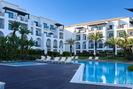 a poolside image in luxury mediterranean villa real estate property