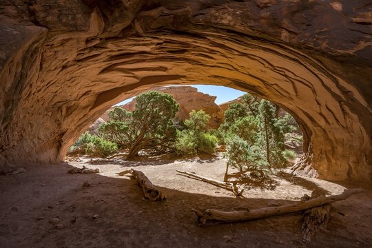 View through rock arch Navajo Arch, Devils Garden, Arches National Park, Moab, Utah, USA