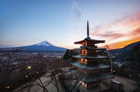 Five-story pagoda of a Shinto Shrine, Chureito Pagoda, with views of Fujiyoshida City and Mount Fuji volcano at sunset, Arakura Fuji Sengen Shrine, Arakurayama Sengen Park, Yamanashi Prefecture, Japan