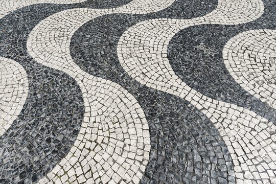 Wavy pattern in pavement, black and white, cobblestones, Rossio, Lisbon, Portugal