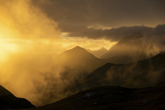 Montafon mountains with dramatic cloudy sky at sunset, Tschagguns, R&auml;tikon, Montafon, Vorarlberg, Austria