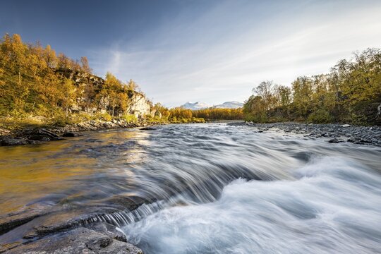 River Abiskoj&aring;kka, Abiskojakka, autumn landscape and snowy mountains in Abisko National Park, Lapland, Sweden