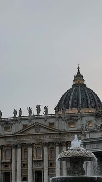 Cinematic shot of St. Peters Square with fountain and Vatican City Basilica