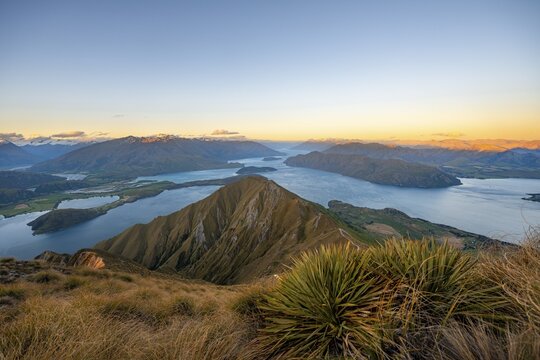 View of mountains and lake from Mount Roy, Roys Peak at sunset, Lake Wanaka, Southern Alps, Otago, South Island, New Zealand