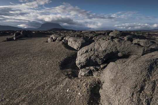 Old lava flow, volcanic landscape, in the background table volcano Her&eth;ubrei&eth; or Herdubreid, Icelandic Highlands, Iceland
