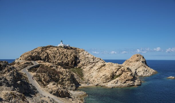 Ile de la Pietra with lighthouse at the tip of L'&Icirc;le-Rousse, Haute-Corse, Corsica, France