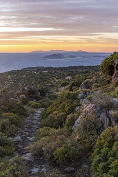 Sunset over the sea, landscape with macchia, in the back islands Gyali and Kos, Nisyros, Dodecanese, Greece
