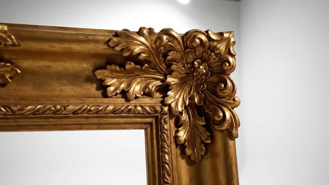 Ornate golden antique frame with intricate carvings in studio