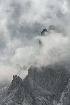 Bizarre mountain peaks with dramatic clouds, Cimon di Croda Liscia and Cadini Group, Sexten Dolomites, Belluno, Italy