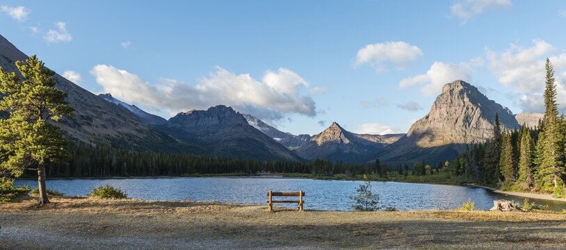 Viewing bench at the mountain lake, Two Medicine Lake, mountain landscape, Sinopah Mountain, Glacier National Park, Montana, USA