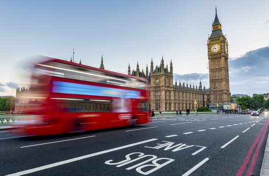Red double-decker bus on the Westminster Bridge, motion blur, Westminster Palace and Big Ben, London, England, Great Britain