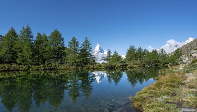 Snow-covered Matterhorn reflected in the lake, Lake Grindij, Zermatt, Wallis, Switzerland