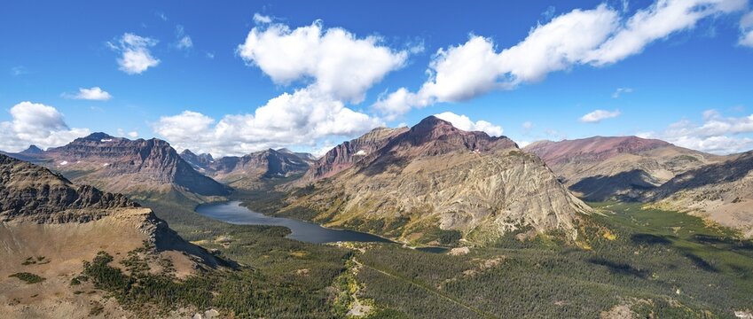 View of Two Medicine Lake, mountain peaks Rising Wolf Mountain and Sinopah Mountain, hiking trail to Scenic Point, Glacier National Park, Montana, USA