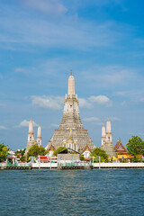 Naklejka premium Beautiful of Buddhist temple or Wat Arun Ratchawararam Ratchawaramahawihan with famous tourist landmark sunlight in the morning, Bangkok, Thailand.