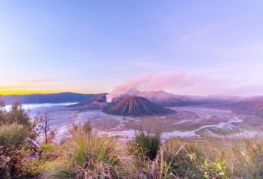 Sunrise, smoking Mount Bromo, Mt. Batok at front, Mt. Kursi at back, Mt. Gunung Semeru, Bromo Tengger Semeru National Park, Java, Indonesia