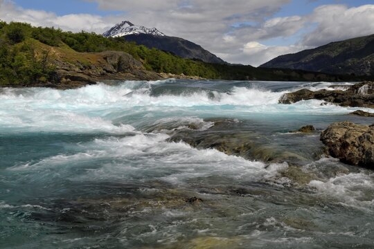 Rapids at the confluence of blue Baker river and grey Neff river, Pan-American Highway between Cochrane and Puerto Guadal, Aysen Region, Patagonia, Chile