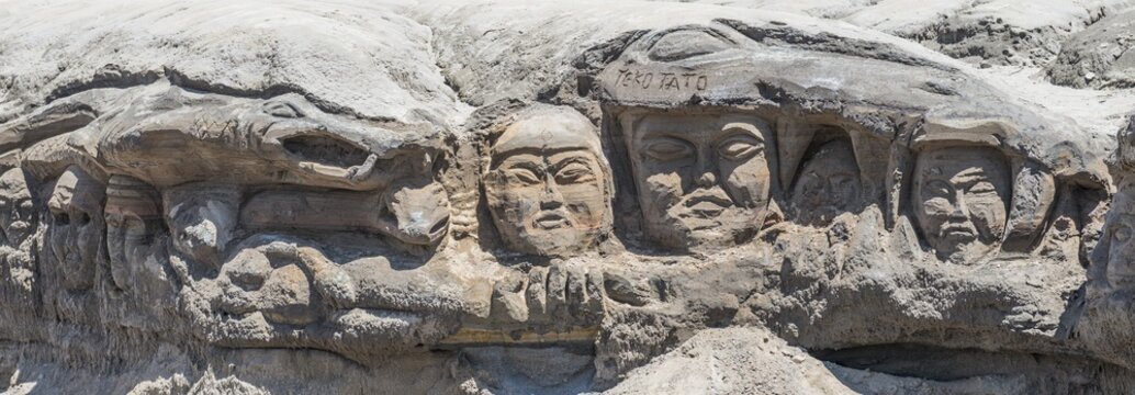 Faces carved into rock, Bromo Tengger Semeru National Park, East Java, Indonesia