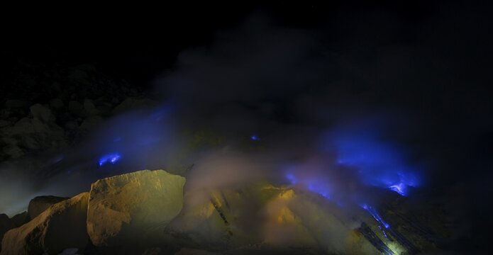 Volcano Kawah Ijen, sulphur and blue fire in the steaming volcanic crater, volcanic complex Ijen, Jawa Timur, Java, Indonesia