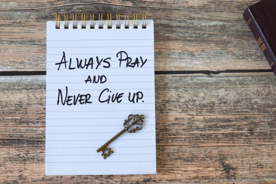 Always pray and never give up, inspirational quote with holy bible and ancient key. Faith in God Jesus Christ, biblical concept.