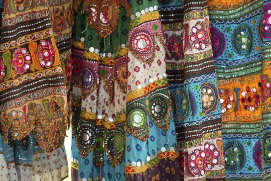 Colourful skirts inlaid with mirrors and different patterns, detail, Udaipur, Rajasthan, India