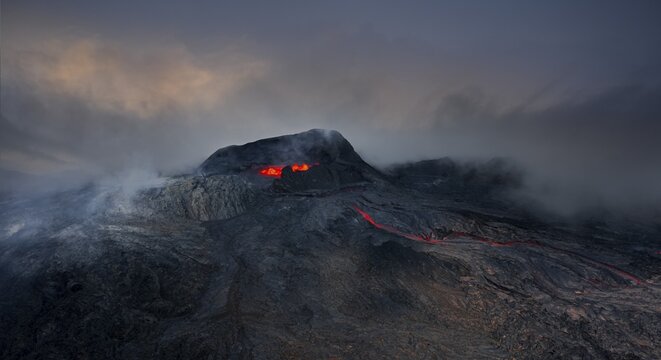 Aerial view, erupting volcano with lava fountains and lava field, crater with erupting lava and lava flow, Fagradalsfjall, Reykjanes Peninsula, Iceland