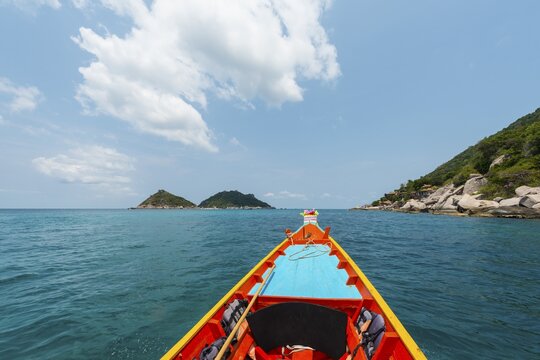 Bow of a moving longtail boat in the turquoise sea, island of Koh Tao, Gulf of Thailand, Thailand