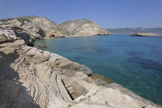Pool carved rock with underground connection to the sea, perhaps used as a fish tank, Cape Fourni, Rhodes, Greece, Europe