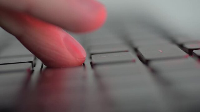 Closeup keyboard enter key pause capturing finger hovering before publish, freelance writer debating blog submission, soft RGB highlights, late night editing mood, quiet focused