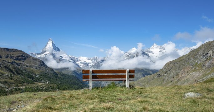 Bench with view, on snow-covered Matterhorn, 5 lakes hiking trail, Zermatt, Valais, Switzerland