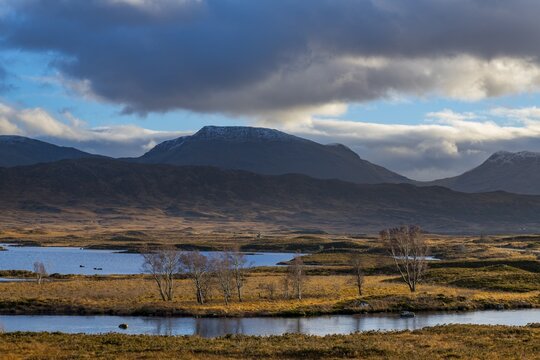Moor landscape with cloudy sky and mountains in the background, Glen Coe, Rannoch Moor, west Highlands, Scotland, United Kingdom