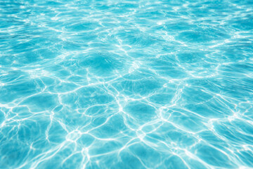 Fototapeta premium Clear turquoise water surface with gentle ripples and reflections