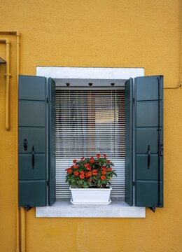 Yellow house, window with flowers, colorful house, colorful facade, Burano Island, Venice, Veneto, Italy