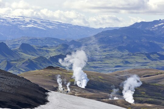 View from the Mt Hrafntinnusker or "Raven Mountain" across hot springs to M&yacute;rdalsj&ouml;kull galcier, Hrafntinnusker, Landmannalaugar, Iceland