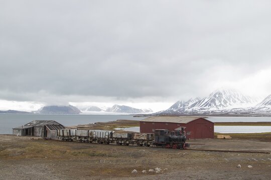 Historic mine train in front of Kongsfjorden, Ny-&Aring;lesund, Spitsbergen, Svalbard and Jan Mayen, Norway