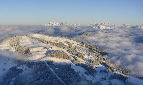 View from the Hohe Salve, Kitzb&uuml;hler Horn and Loferer Steinberge, mountain panorama in winter, mountain peaks towering above cloud cover, SkiWelt Wilder Kaiser Brixental ski area, Brixen im Thale, Tyrol, Austria