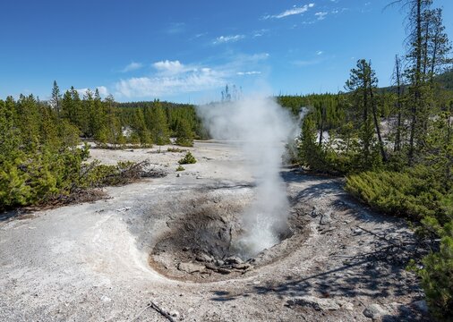 Splashing water in a steaming hot spring, Noris Geyser Basin, Yellowstone National Park, Wyoming, USA