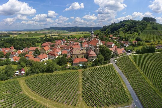 Village center wine village Castell with county church St. Johannes and vineyard Schlossberg, near Wiesentheid, Steigerwald, Lower Franconia, Franconia, Bavaria, Germany