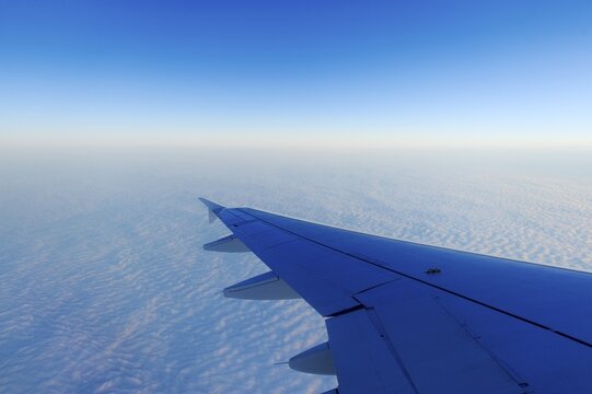 Airplane wings over a sea of fog, Basel, Switzerland, Europe