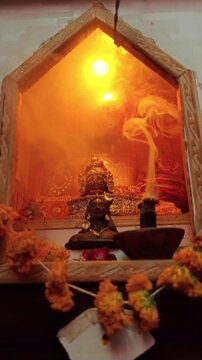 Lord Mahakal Shiva Statue in Hindu Temple with Holy Incense Smoke and Warm Cinematic Lighting
