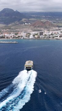 Aerial view of High-Speed Ferry Arriving in Los Cristainos in the South of Tenerife, Canary Islands
