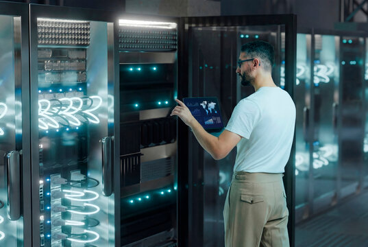 3D network engineer server with laptop in illuminated rack aisle