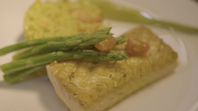 White Fish Fillet With Asparagus and Rice On Plate Close Up Food Presentation