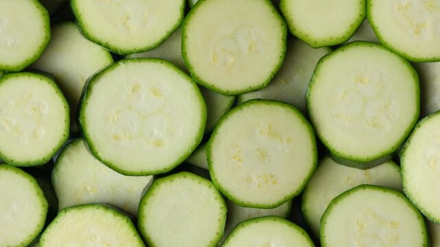 Top View of Fresh Sliced Zucchini Rounds Arranged Together.