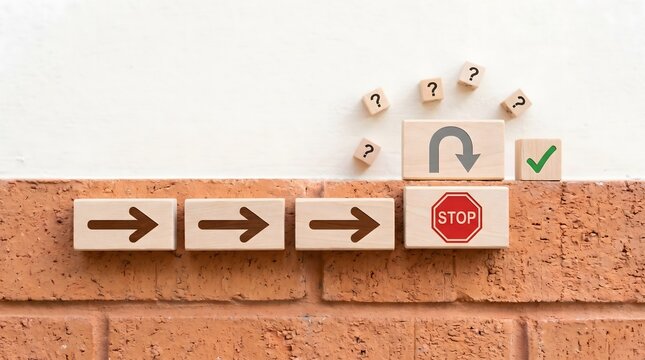 Arrows, stop sign, and U-turn symbol on cubes, indicating pathway and choices.